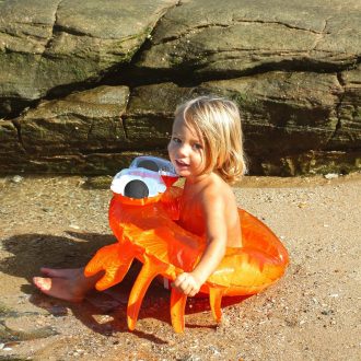 SUNNYLiFE | Kiddy Inflatable Pool Ring, Sonny the Sea Creature Neon Orange